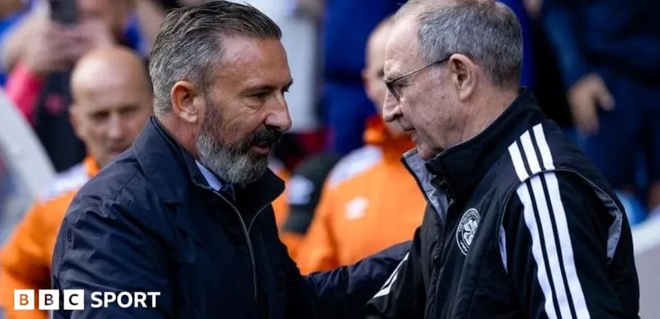 Two football managers shaking hands before match
