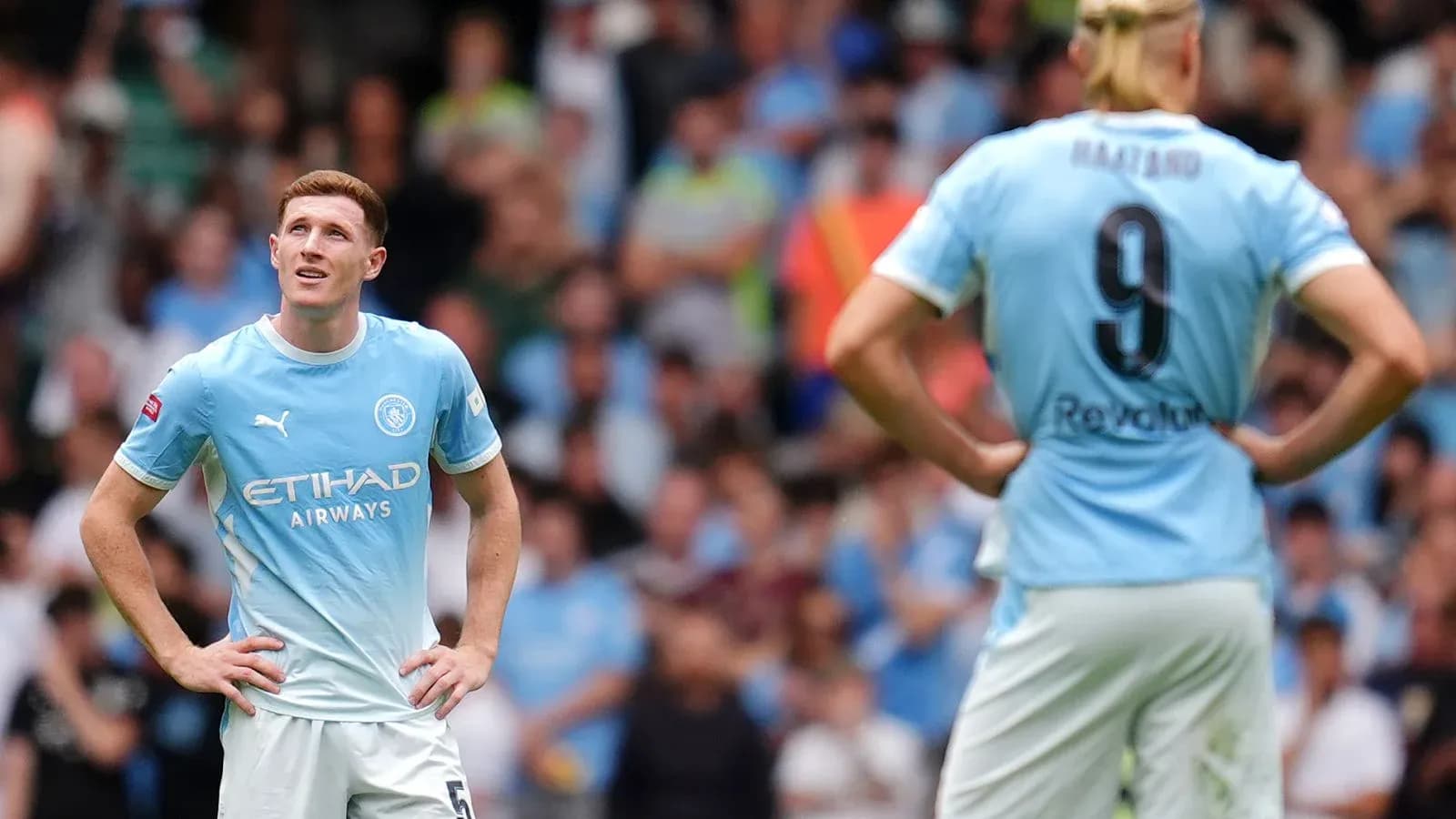 Two Manchester City players during a match