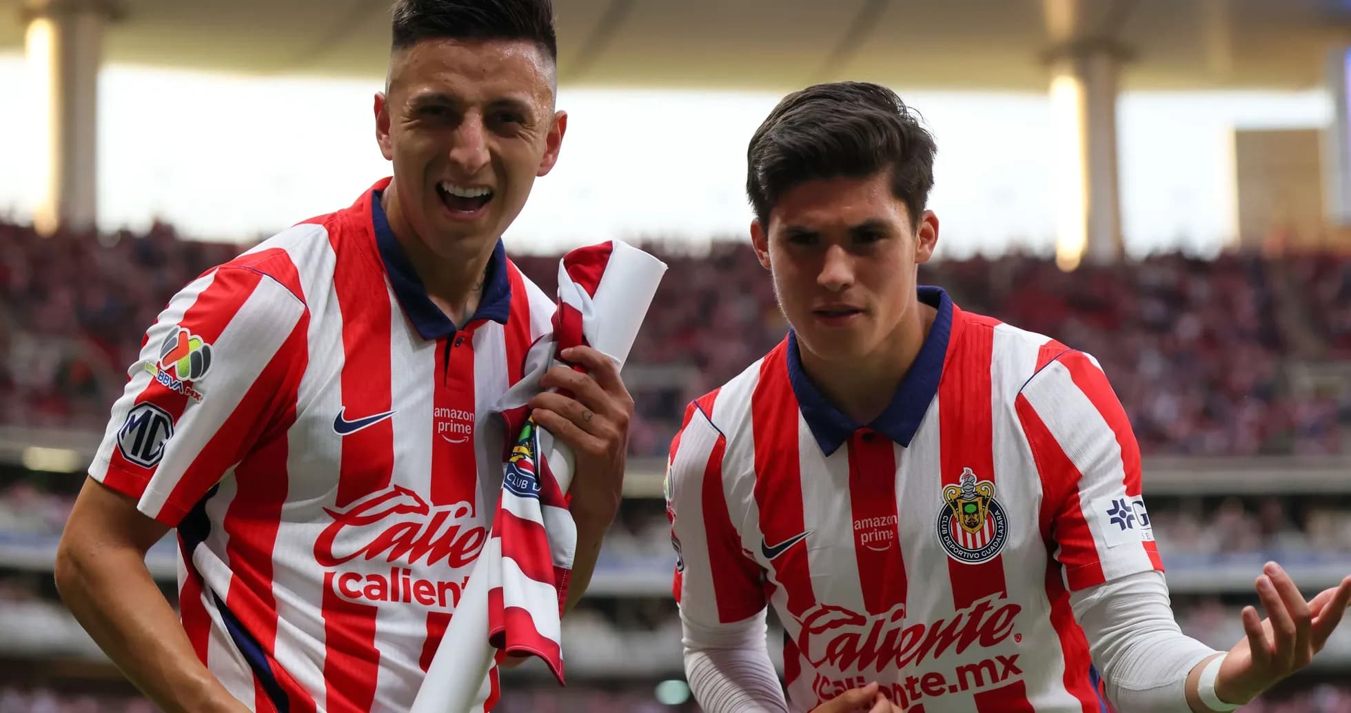Chivas players celebrating during Liga MX match