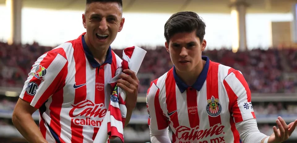 Chivas players celebrating during Liga MX match