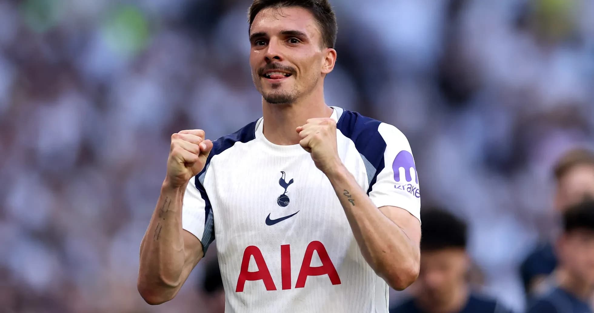 Tottenham player celebrating victory during match