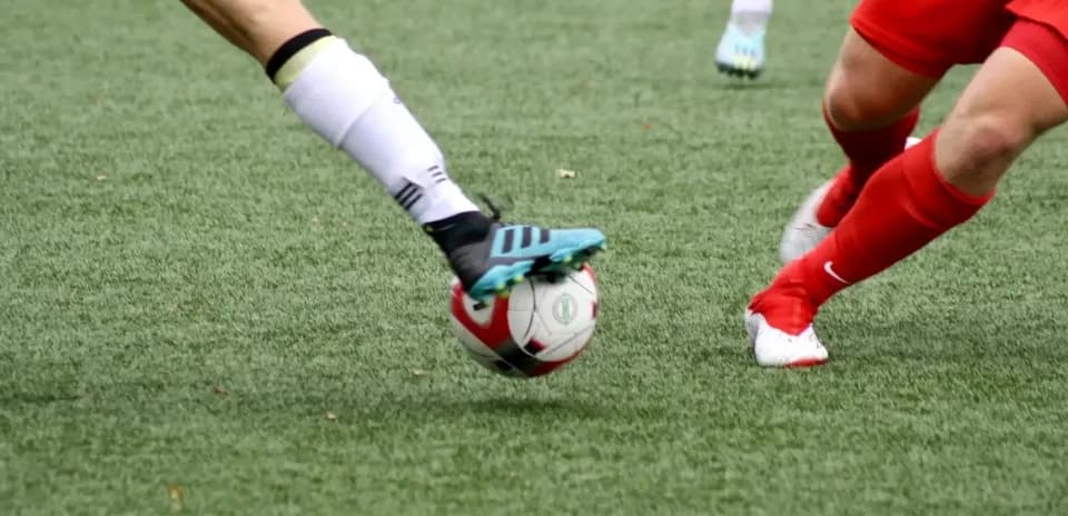 Players competing for the ball on the field