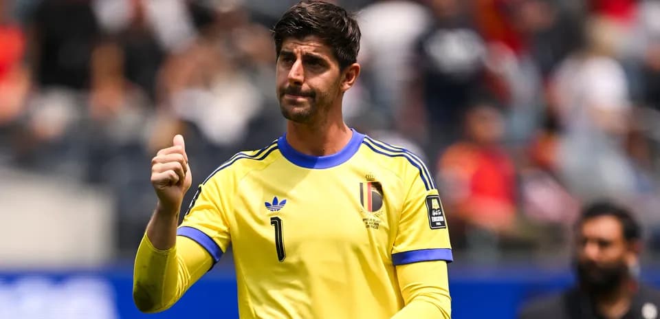 Goalkeeper in yellow jersey gesturing during match