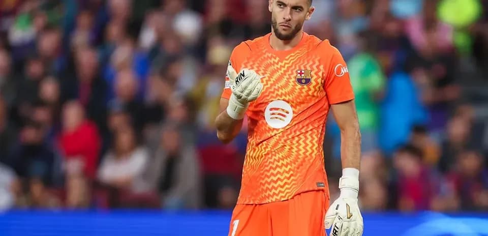 Goalkeeper in orange kit during a match