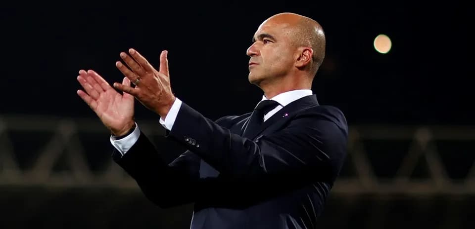 Coach applauding during a football match