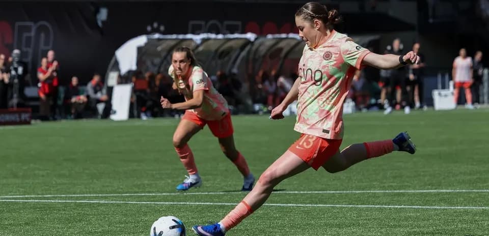 Portland Thorns player kicking soccer ball