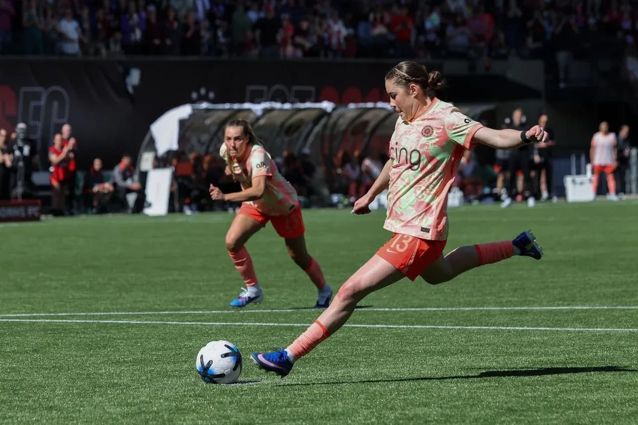 Portland Thorns player kicking soccer ball