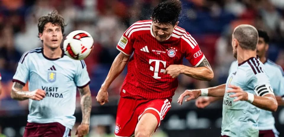 Player heading the ball during a football match