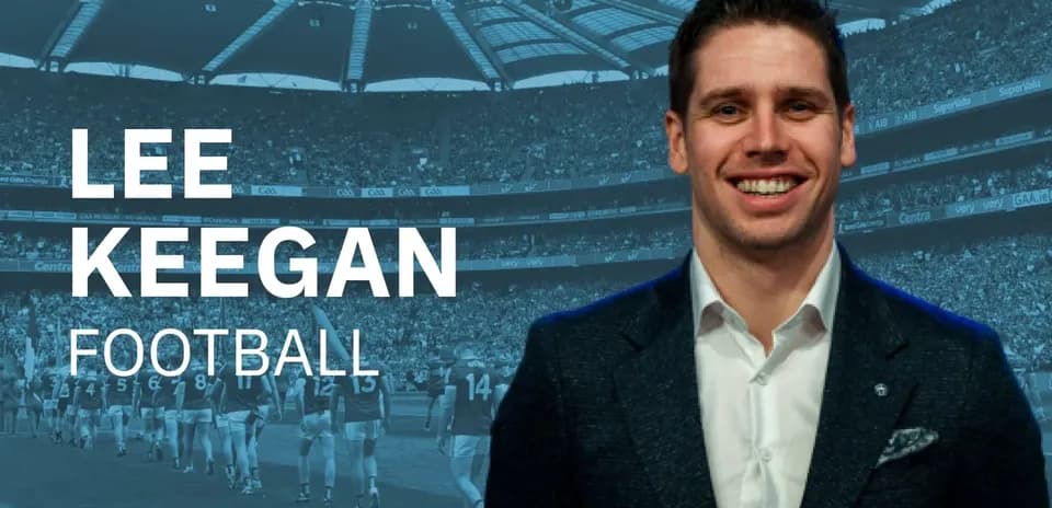 Lee Keegan smiling in front of a stadium