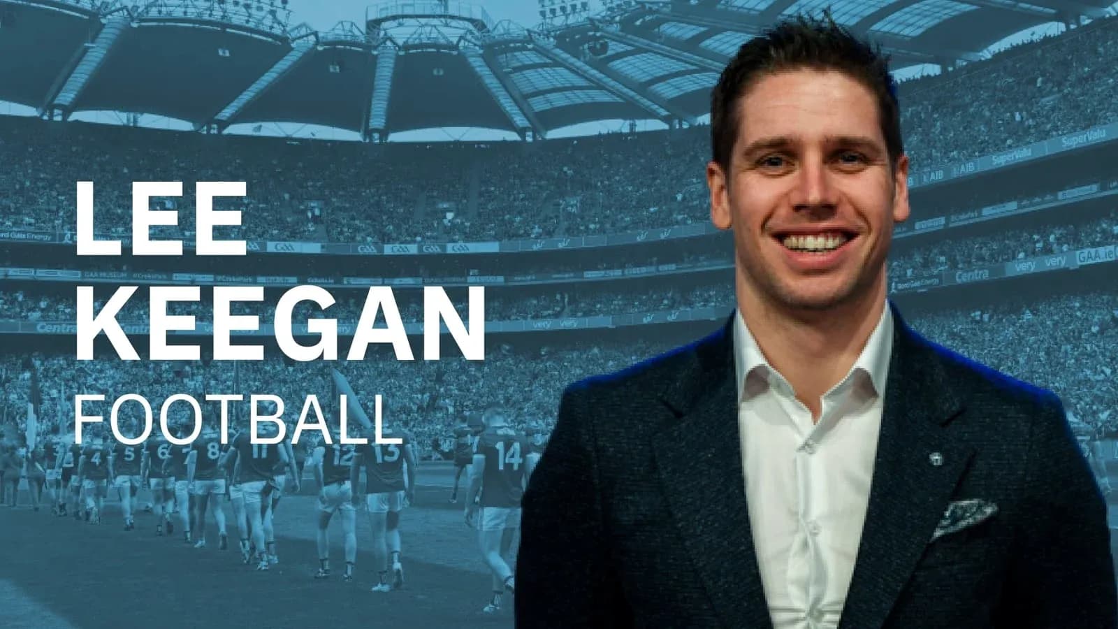 Lee Keegan smiling in front of a stadium