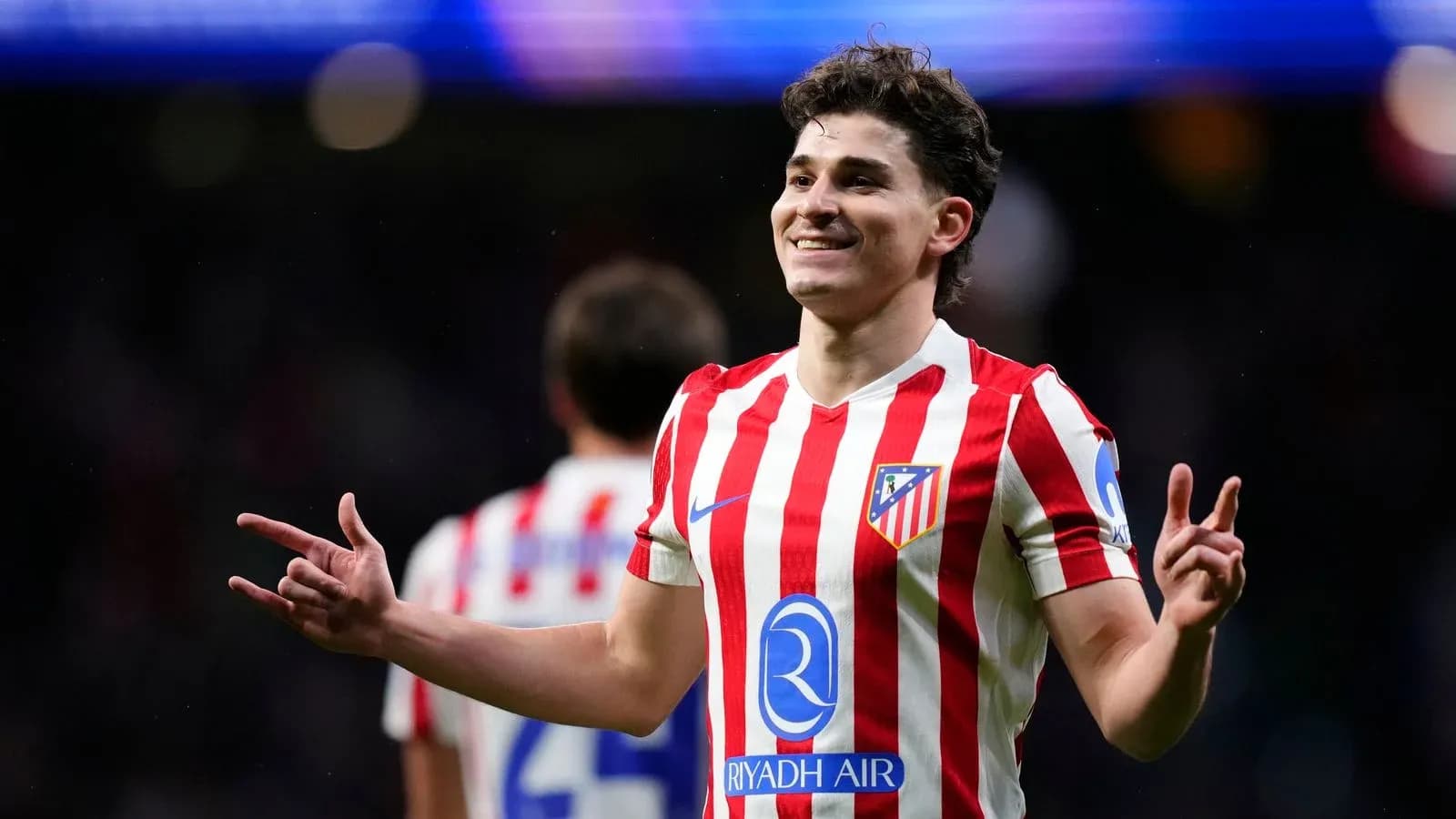 Atletico Madrid player celebrating on the field