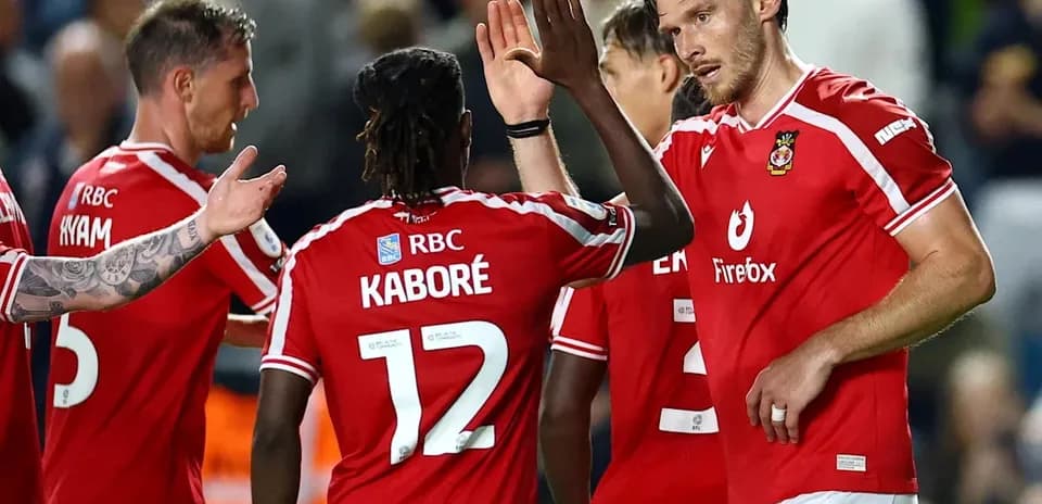 Players celebrating after scoring a goal during match