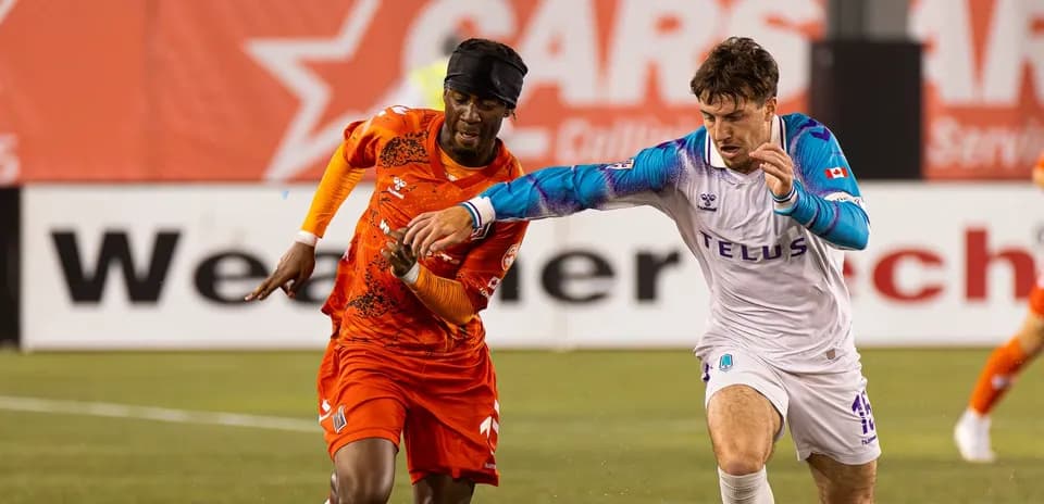 Players competing for the ball in match