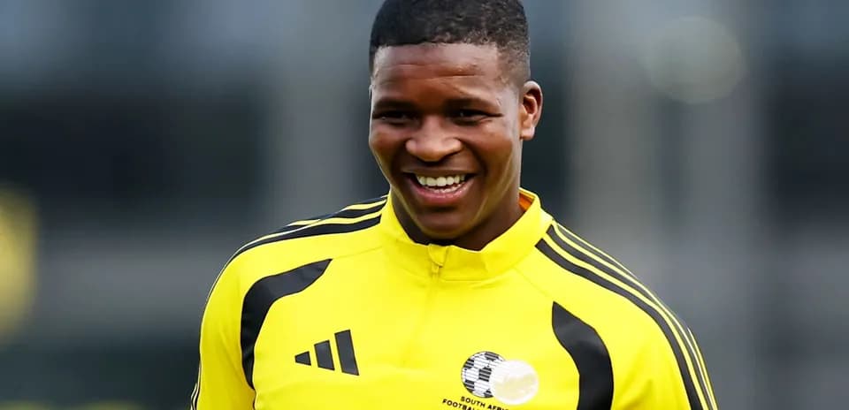 Player smiling in yellow training kit during session