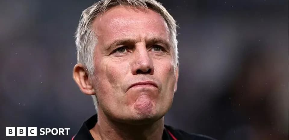 Coach with serious expression during match