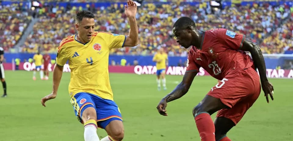 Colombian player and opponent contesting the ball