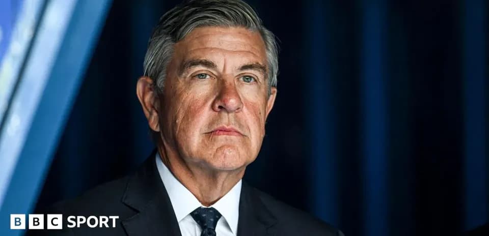 Man in suit looking serious at event
