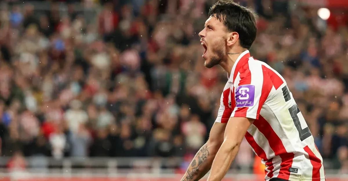 Player celebrating passionately in front of fans