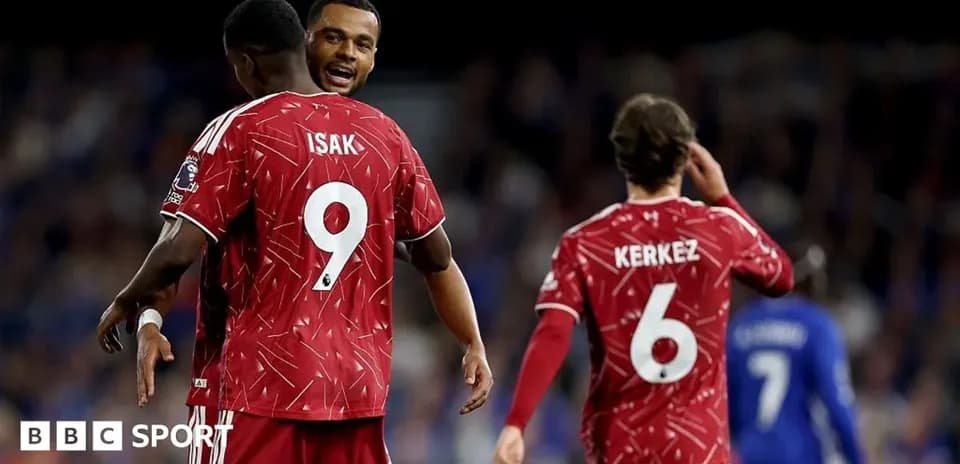 Players celebrating in red jerseys during match