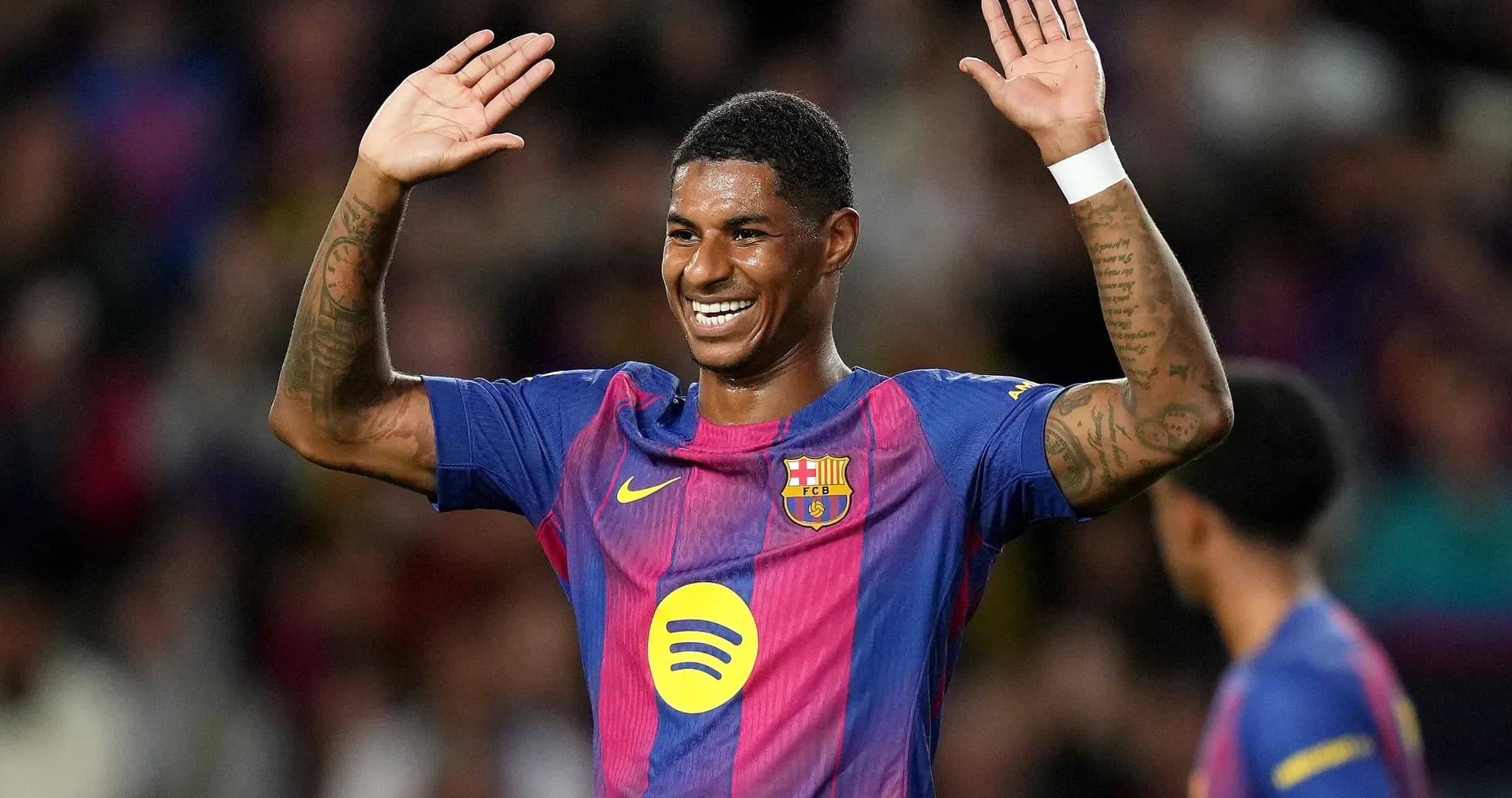 Player celebrating with raised hands on the field