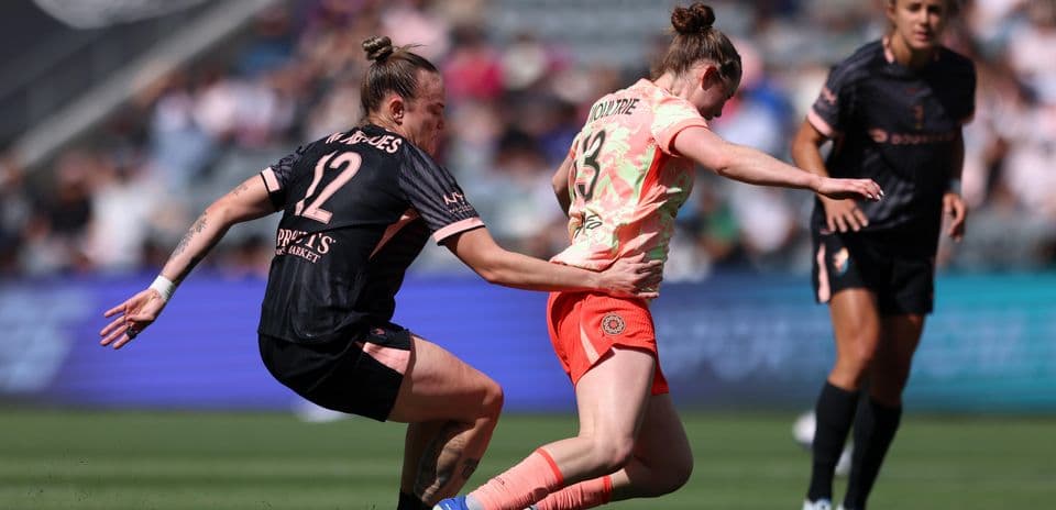Players contesting for the ball during match