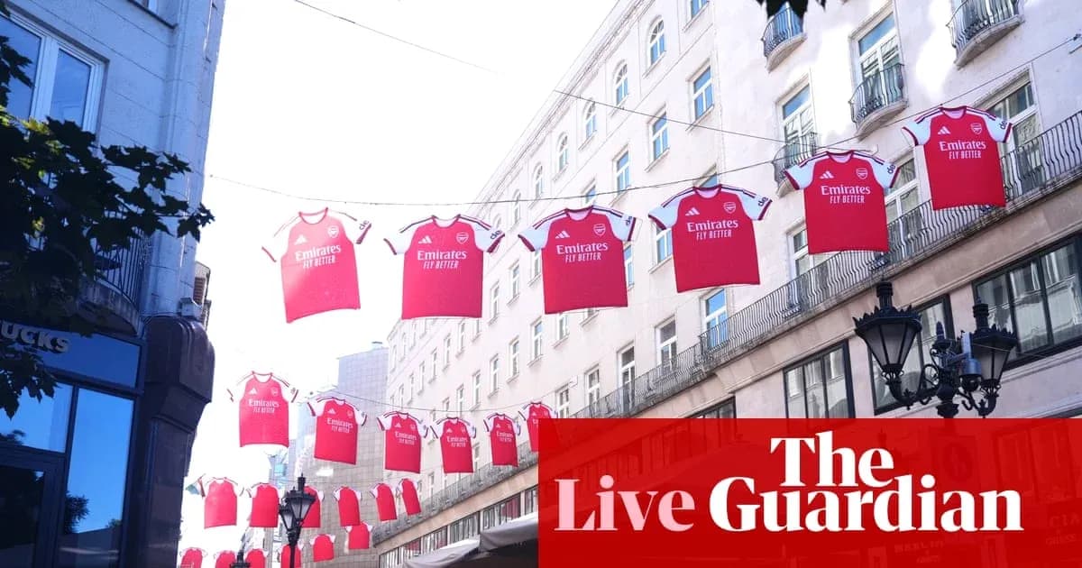 Red Arsenal jerseys hanging across a street