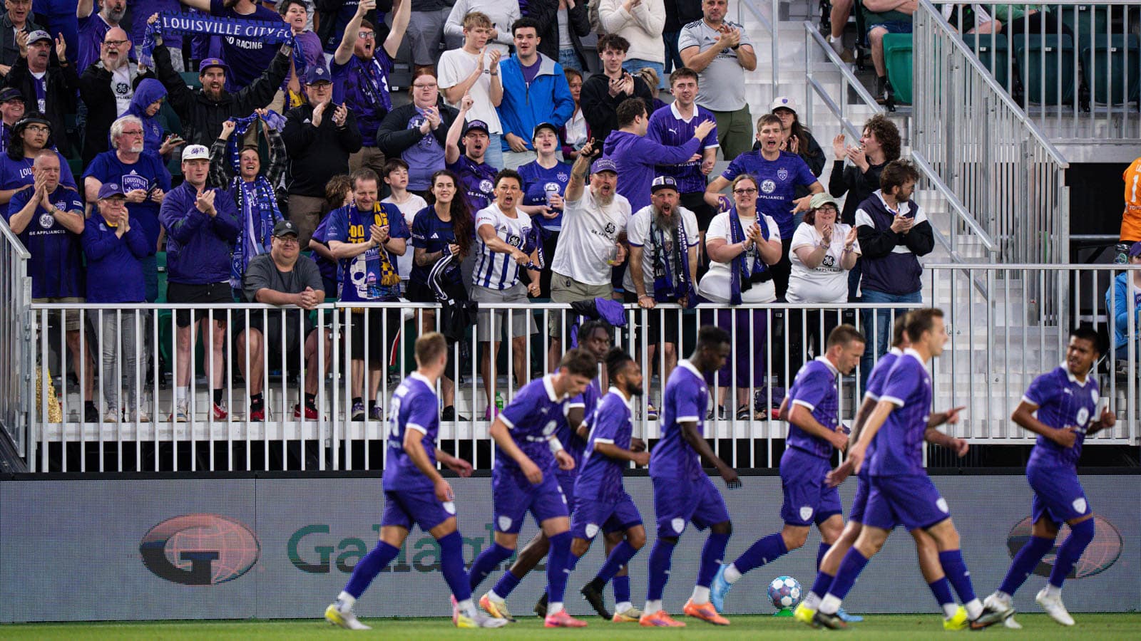 Louisville City fans celebrating during match