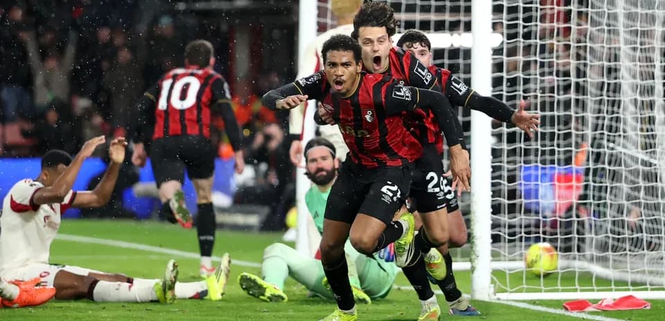 Bournemouth players celebrating a goal against Liverpool