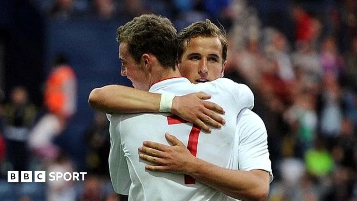Two players hugging on the football pitch