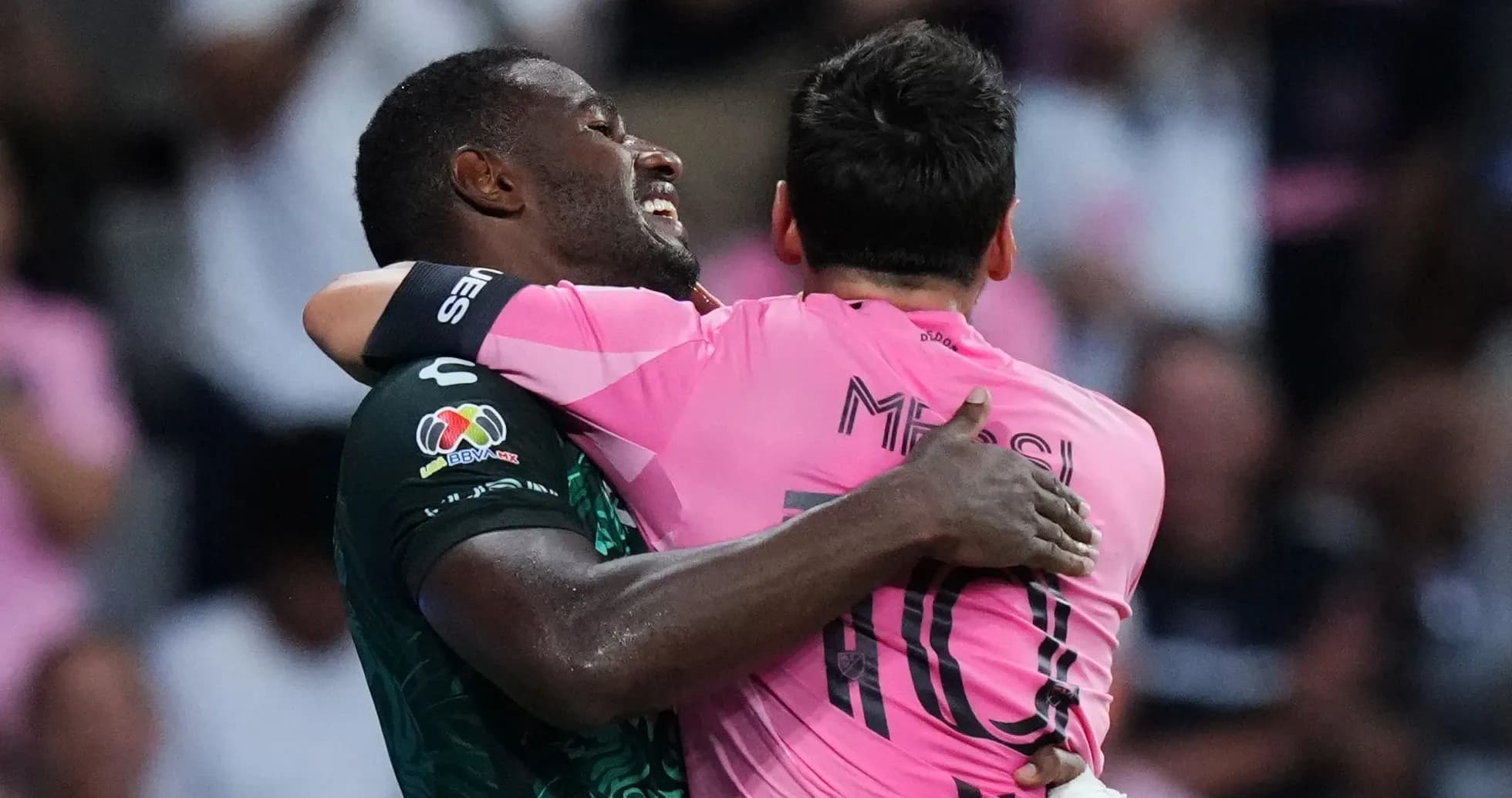 Two players embracing on the field after match