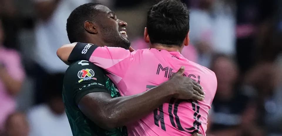 Two players embracing on the field after match