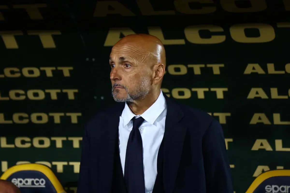 Coach standing in front of team bench during match