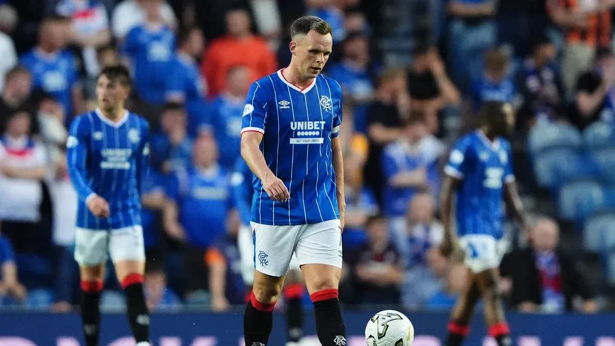 Rangers player walking on pitch during match