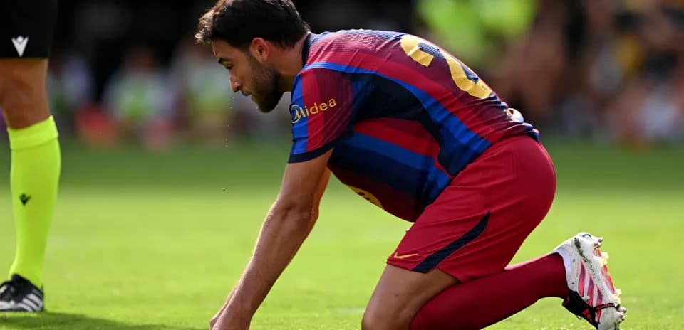 Player kneeling on pitch during a match