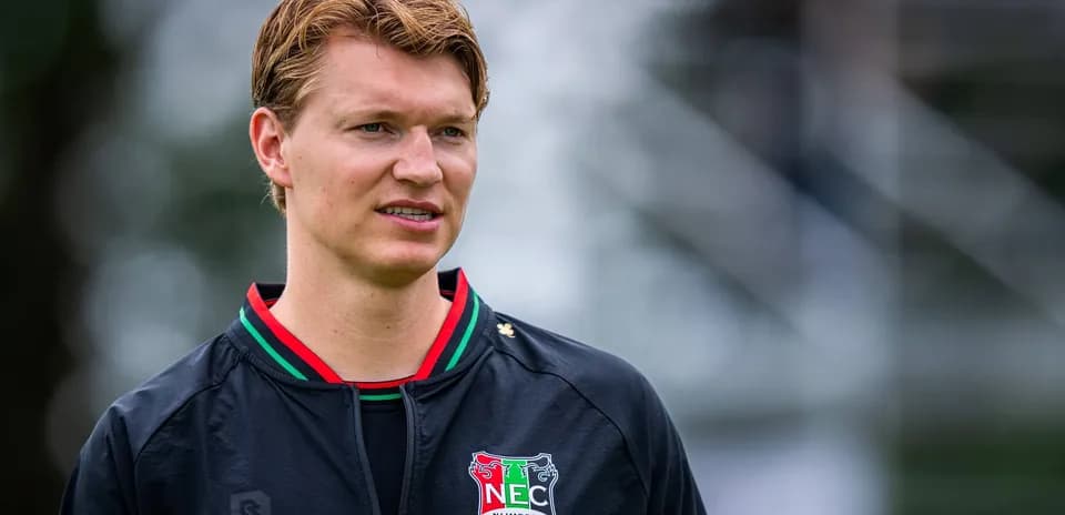 Player wearing NEC Nijmegen training jacket outdoors