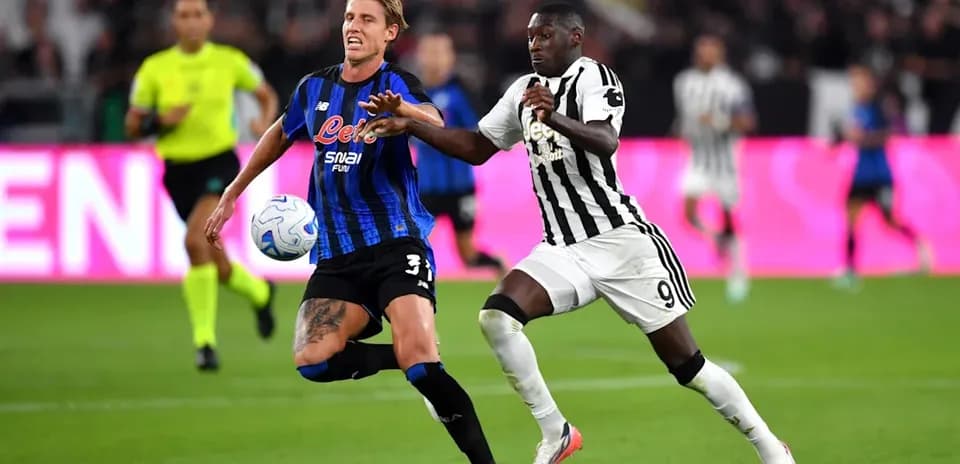 Two players competing for the ball during match