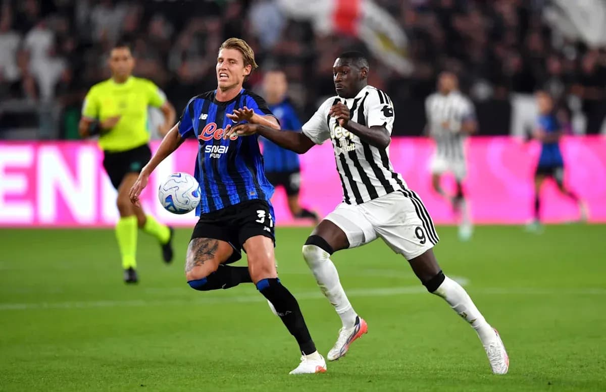 Two players competing for the ball during match