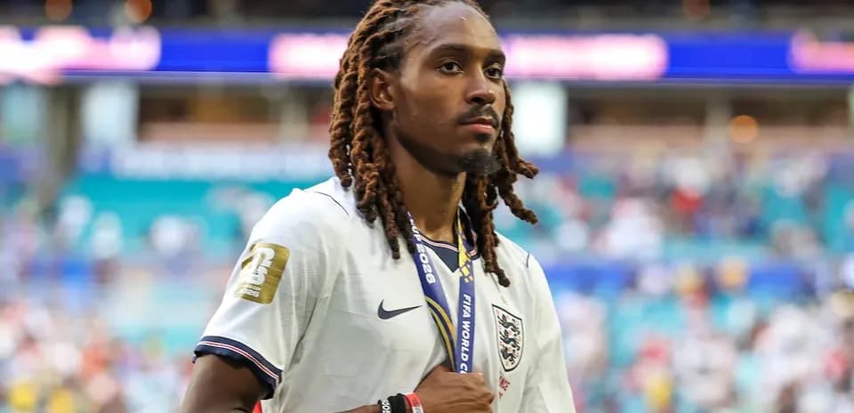 Player wearing England jersey with medal on neck
