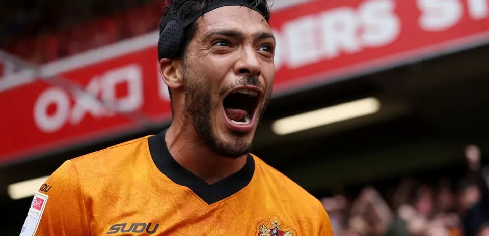 Player celebrating enthusiastically in orange jersey