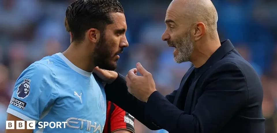 Coach discussing tactics with player during match