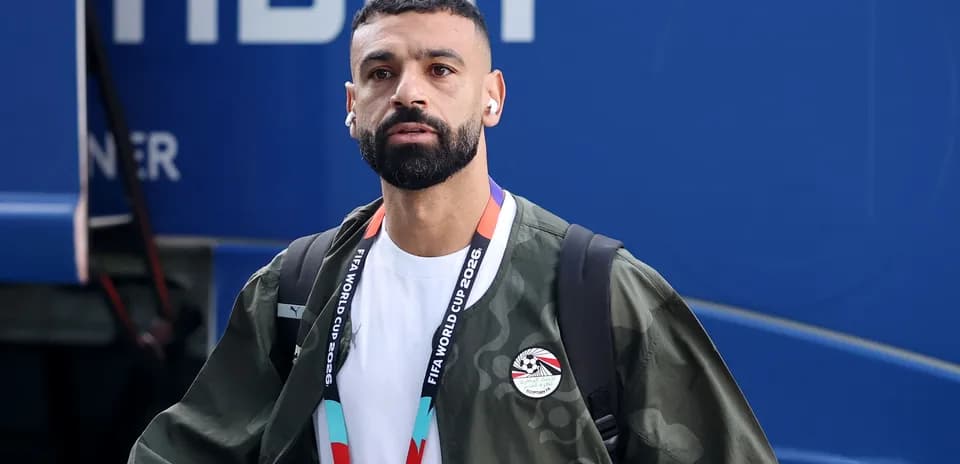 Player arriving with earphones and FIFA lanyard