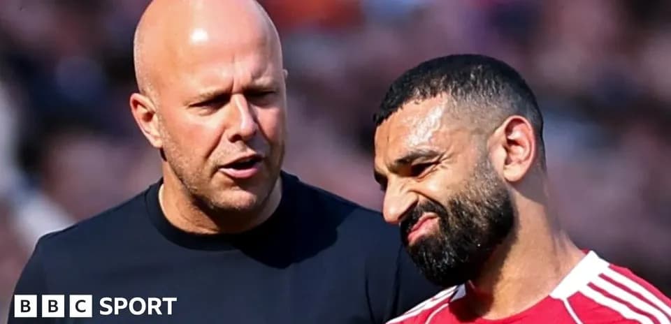 Two men discussing on the field during match