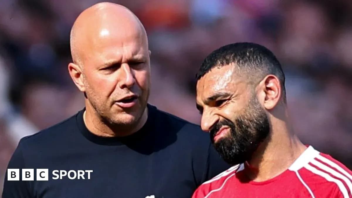 Two men discussing on the field during match