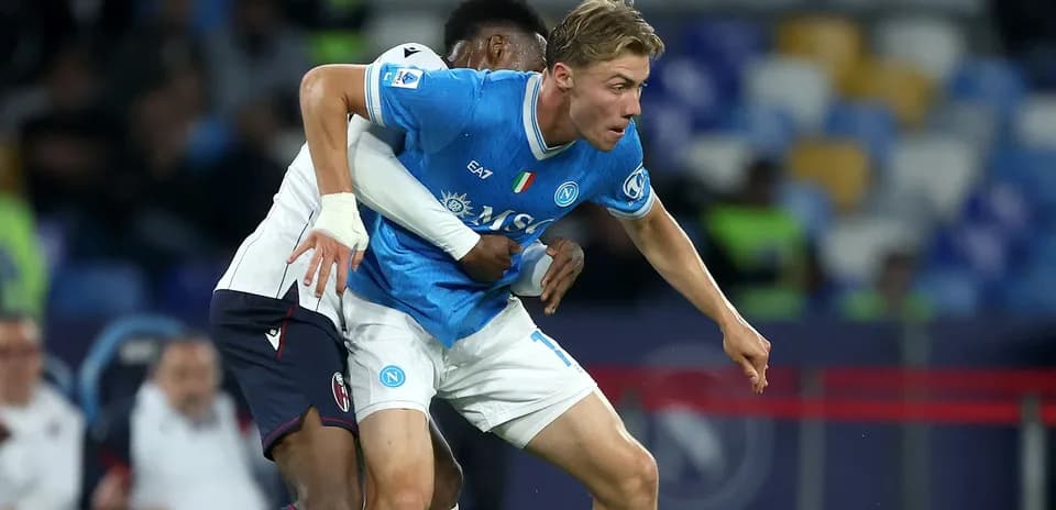 Napoli player being tackled during a match
