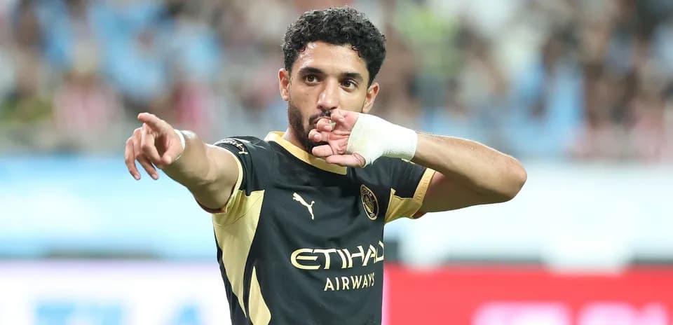 Player gesturing during a football match celebration