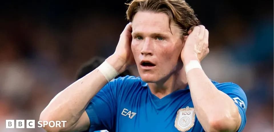 Player holding head in blue jersey during match