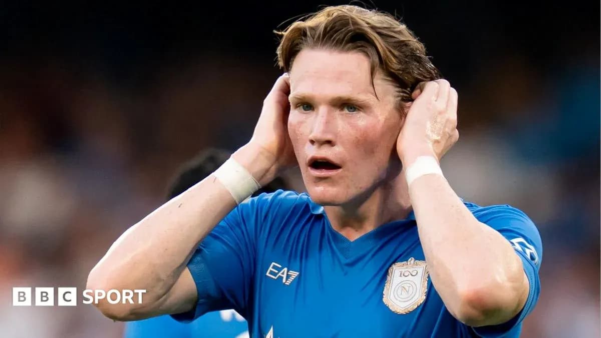 Player holding head in blue jersey during match