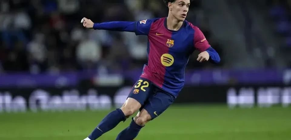 Barcelona player dribbling the ball during match