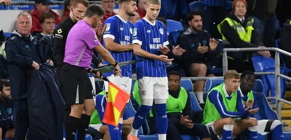 Substitution taking place on the football pitch
