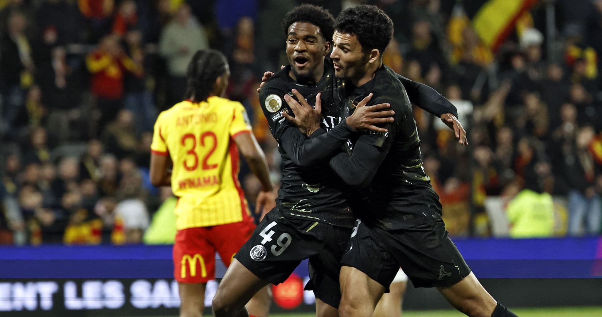 Players celebrating a goal during a match